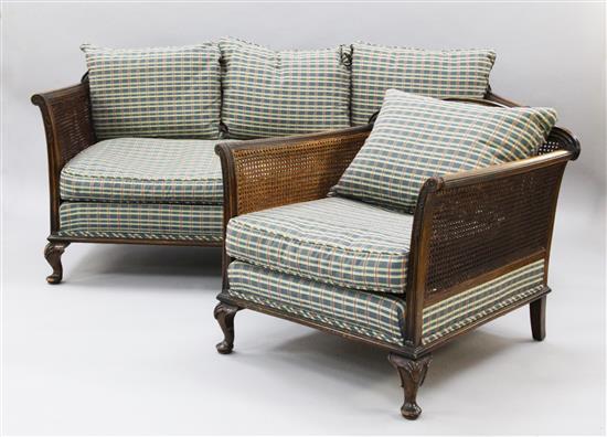 A 1930s mahogany double caned three piece bergere suite,